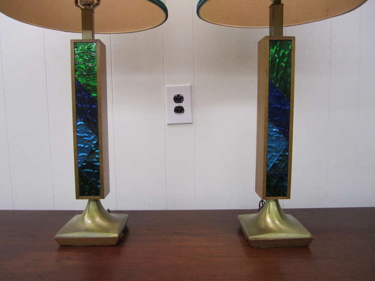 Rare pair of Georges Briard mosaic glass lamps with their original shades.  I really love the the use of blue and green glass with metallic backs.  The original shades are really cool with the bit of blue/green metallic trim along the bottom and