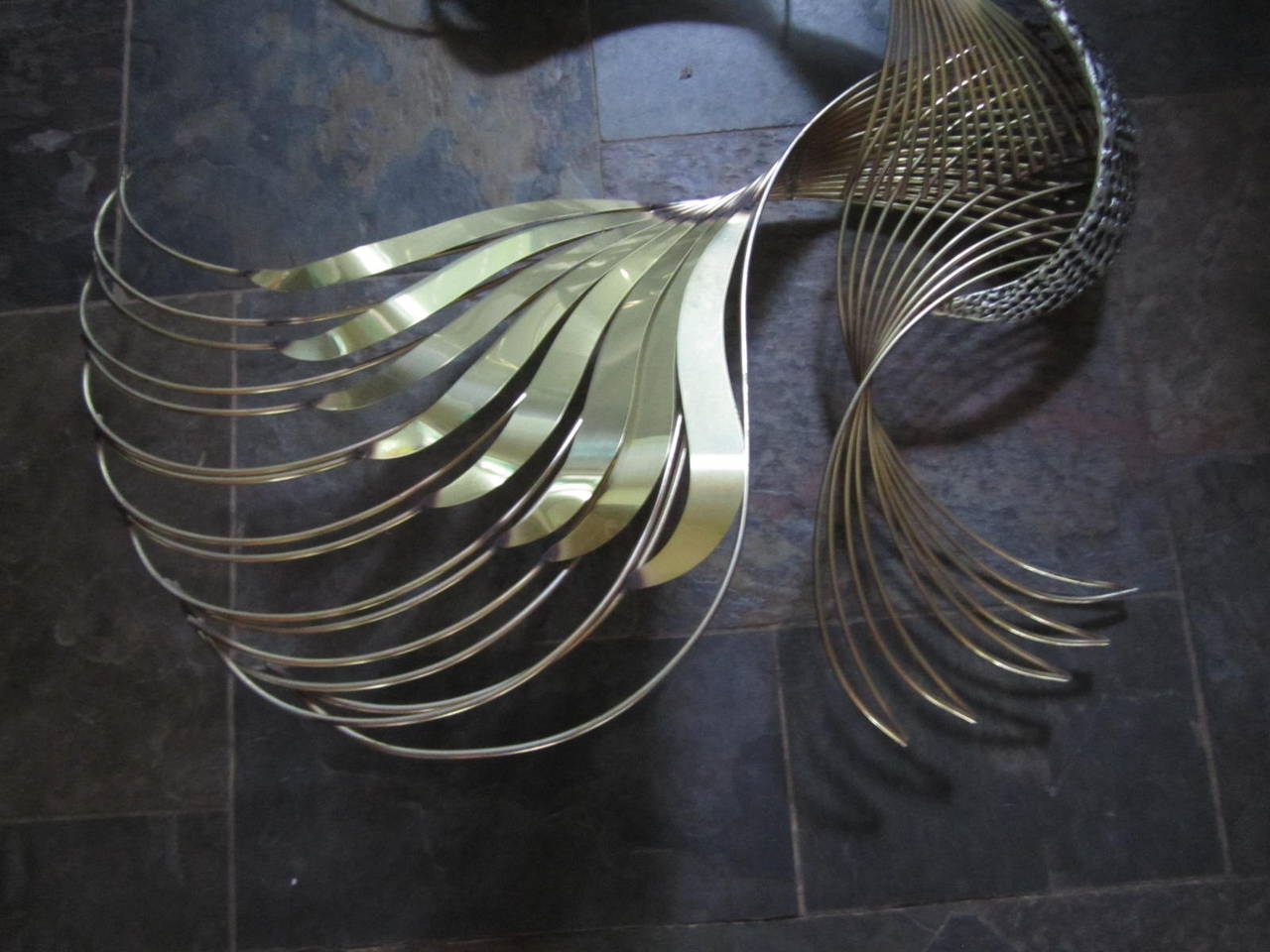 Outstanding and large-scale Curtis Jere brass bird of paradise wall sculpture. This piece is even more magnificent in person, the photos do not show all the detail and patina variations. This bird is very well crafted and in great vintage condition.