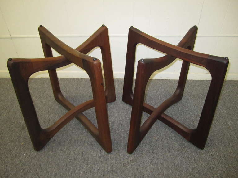Beautiful pair of vintage 1960s modern tables designed by Adrian Pearsall for Craft Associates. Sculptural bases formed with interlocking open forms in solid walnut with round glass tops. Engaging design and impeccable craftsmanship.  This pair