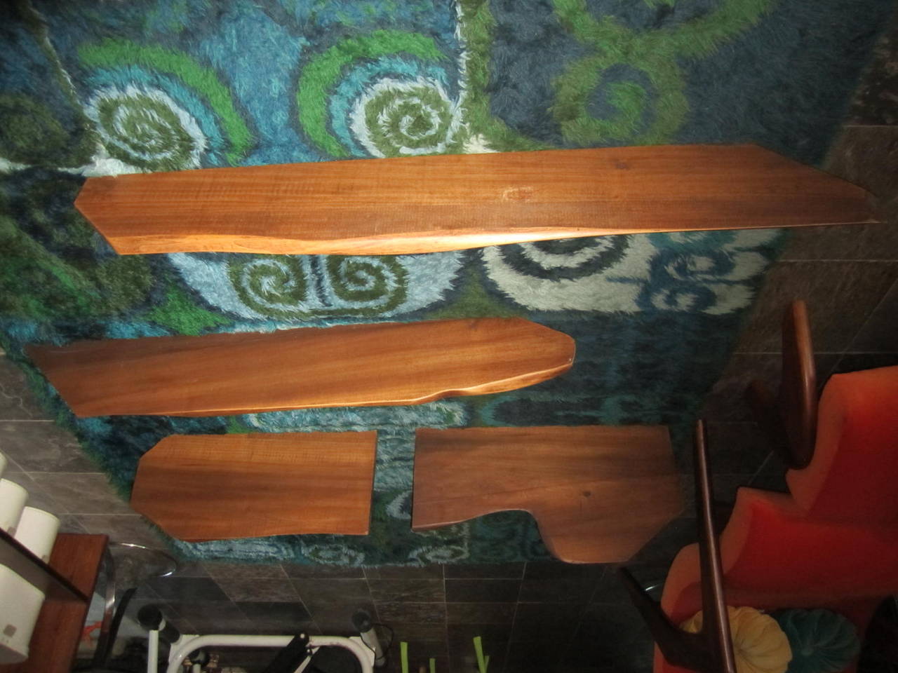 Fabulous set of four different size solid walnut sculptural Nakashima style floating shelves. Each one is a different size and shape and can be arranged in many ways. The two largest measure 48