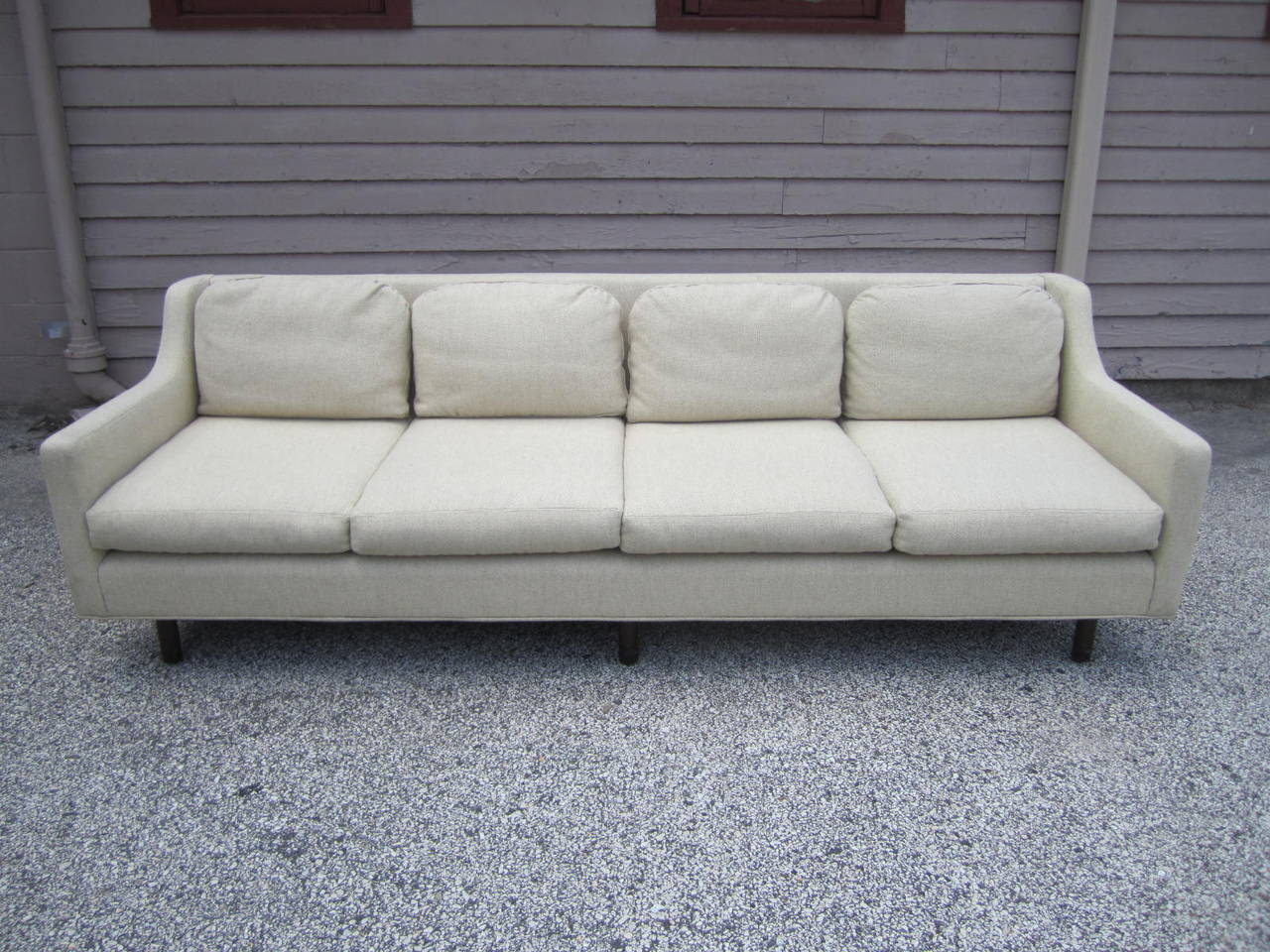 Lovely Dunbar style mid-century modern 4 seater sofa.  Super clean nubby oatmeal fabric is original and still looks great.  The cushions are down-filled and are super comfortable.  Came from an estate full of signed Dunbar pieces.