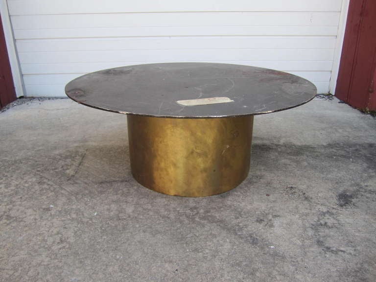Fabulous Silas Seandel style solid brass and marble coffee table. The solid brass drum shaped base has a  marvelous vintage patina and looks great. The creamy taupe colored marble top is thick and heavy and has great veining.  This piece is well