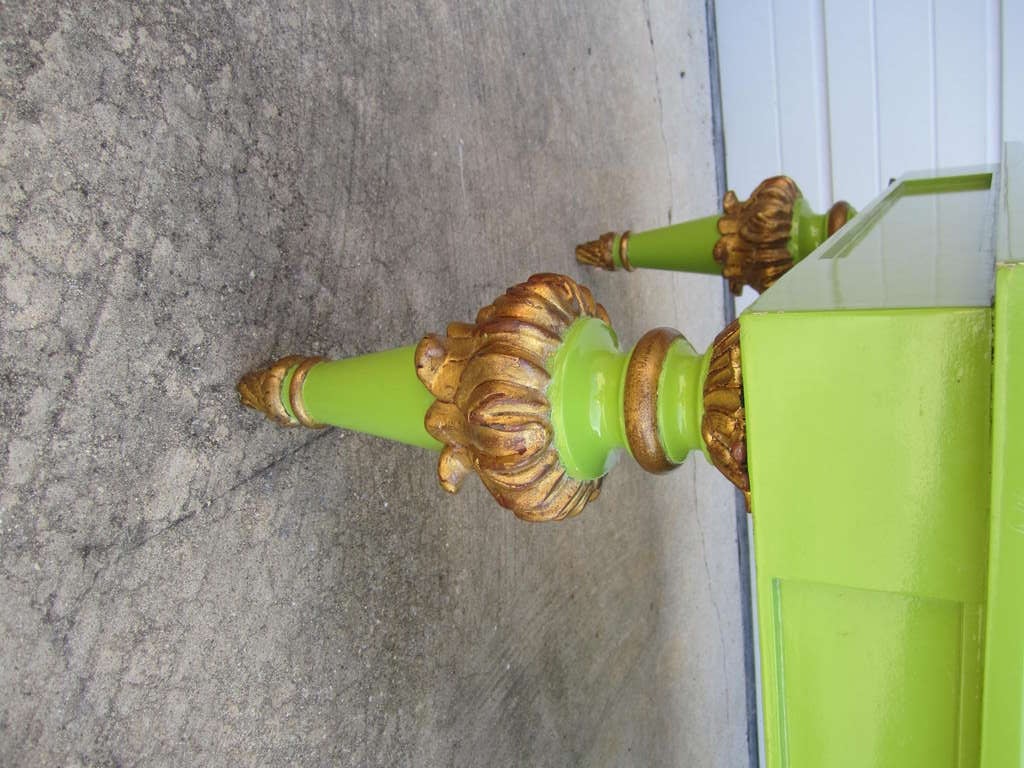 Totally outrageous lime green lacquered coffee table with glamorous gilded gold carved legs.  This piece makes you look twice and go- wow!  Oversized hand carved regency style legs take this table to another level.  The heavily lacquered lime green