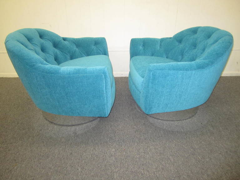 Gorgeous pair of totally restored chrome base swivel chairs. A sumptuous shade of high end woven turquoise fabric has been chosen for the upscale re-upholstery. Chrome bases have been re-chromed and look dazzling-these chairs are in top showroom