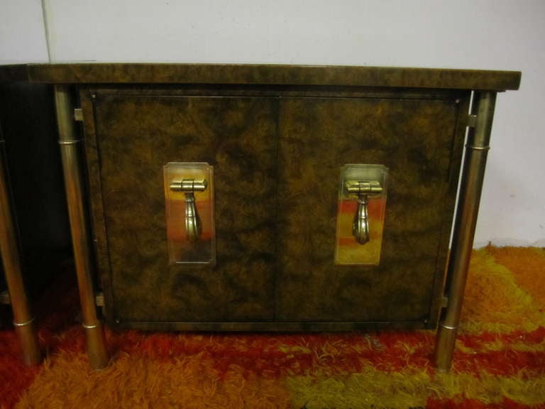 Outstanding pair of burled walnut and brass mastercraft night stands.  Stylized thick bamboo legs give the illusion of the cabinet floating. Each door has heavy solid brass pulls-they open to reveal a nice open space with a singular shelf . All
