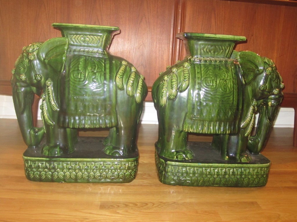 PAIR OF REGENCY  MODERN GREEN GLAZED TERRA COTTA ELEPHANT STOOLS
