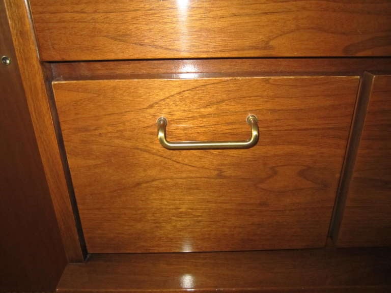 Handsome six drawer shingle front dresser designed by Merton Gershun. This particular line is exceedingly well crafted and heavy, a hidden treasure in American Mid-Century Modern in our opinion. Beautiful walnut figuring and color, accented by satin