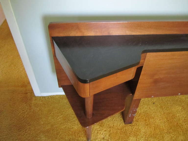 Rare American of Martinsville headboard with built in night stands.  There is a singlar drawer and one shelf on either side topped with a black formica top.  I love the brass sabot detail on the peg legs.  I have several other pieces from this same