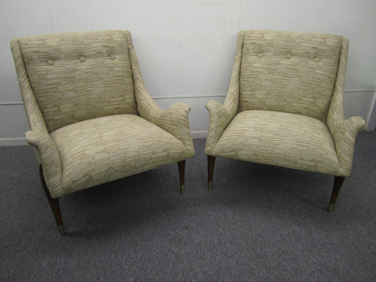 Amazing and rare pair of Gio Ponti style gull wing lounge chairs.  We have never seen another pair of these so they are extremely rare.  These fabulous chairs have been completely restored with lovely high quality knoll fabric and refinished walnut