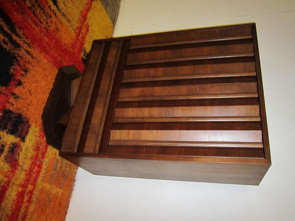 Unusual Mid-century modern tall 3 dimensional walnut dresser.  Just look at the wonderful pleated solid walnut doors and drawers.  Tons of storage options with drawers, open spaces, and shelves.  I love the solid wood sturdy pedestal base.  I do