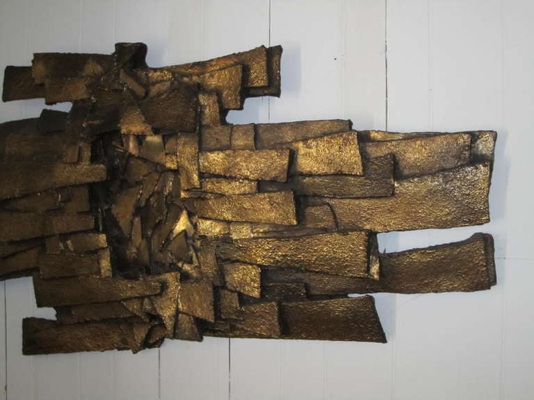 Outstanding brutalist style heavy resin wall sculpture.  The size alone is impressive.  Deep carved textured strips are overlapped to give this sculpture a dynamic presence.