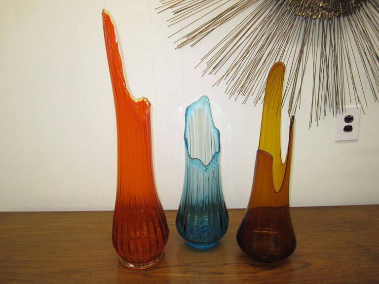 We are selling these lovely and colorful vases by the piece. They are all in perfect condition and will add a splash of whimsy and color to any space. HGTV's David Bromstad said this is his new obsession-collecting viking art glass. I think it will