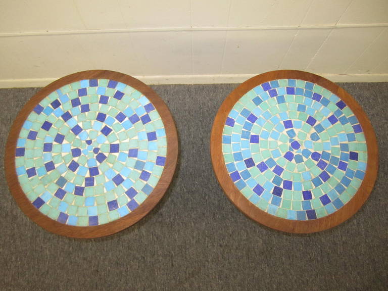 Lovely pair of Gordon Martz attributed turquoise and blue tile top tables. Wonderful colors of blue glass tiles circle the top of the solid walnut tables. One table is slightly taller than the other but is only noticed when they are directly next to