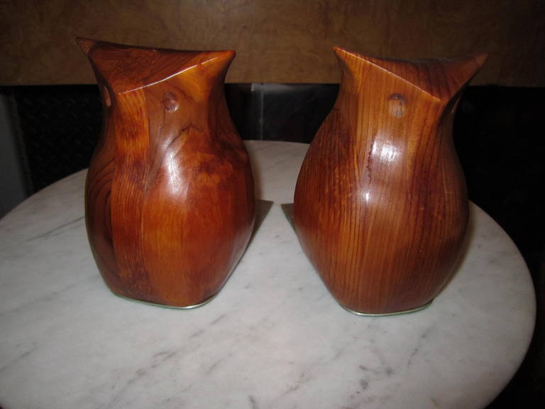 Whimsical pair of carved solid walnut owl bookends by artisan Deborah Bump. Well carved owls in her well-known Minimalist Mid-Century style. This is the 1st pair of bookends I have ever seen from this sculptress known for her darling animal inspired