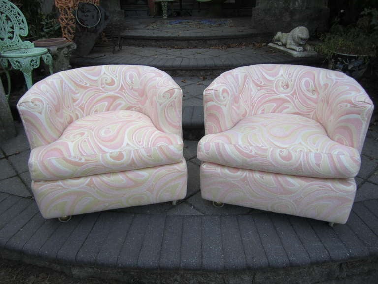 Outstanding pair of Milo baughman style rolling lounge chairs.  The Pucci inspired woven fabric is in near perfect condition.  The psychedelic high end fabric is wild and subtle at the same time. These super mod chairs are in top notch vintage