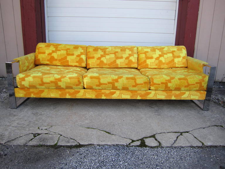 Gorgeous Craft Associates wide chrome band sofa with walnut side panels.  This piece retains it original bright yellow cut velvet fabric in very nice vintage condition. The thick chunky chrome band arms are over the top fabulous.  I love the use of