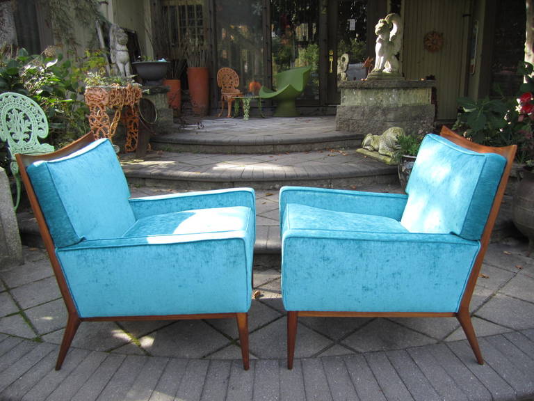 Outstanding pair of totally restored Paul McCobb lounge chairs. These chairs are in perfect restored condition with new foam and high end silk velvet. The solid walnut frames have been refinished and look amazing. You will be very impressed with the