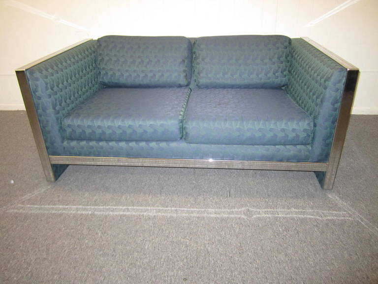 Lovely petite chrome flatbar sofa loveseat.  This piece has newer fabric and still looks great as is.  Would be perfect for reupholstery-the chrome flat bars show only very mild wear.  Please not we do have 2 of these loveseats if a pair is needed. 