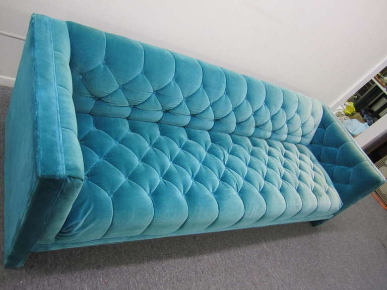 Lovely mid-century modern Tuxedo tufted sofa.  This piece retains it's original turquoise velvet sofa and looks quite nice.  I love the slightly worn look to the fabric-gives a vintage chic only time can give.