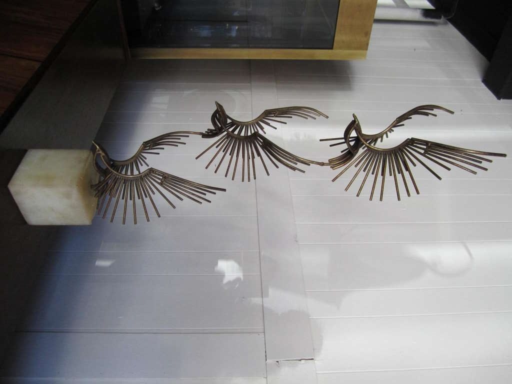 Wonderful C.Jere table sculpture of 3 flying eagles on a solid marble base.  I love the large scale size of this table top sculpture along with the subject or the soaring eagles.  In my showroom i have paired this with a tall lightup C.Jere brass