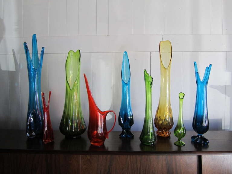 Fabulous collection of 9 colorful Viking glass vases.  Your going to love this hand selected collection of fun vibrant mid-century modern vases.  Seems to have the right amount of tall and smaller pieces to give the right look all you designers are