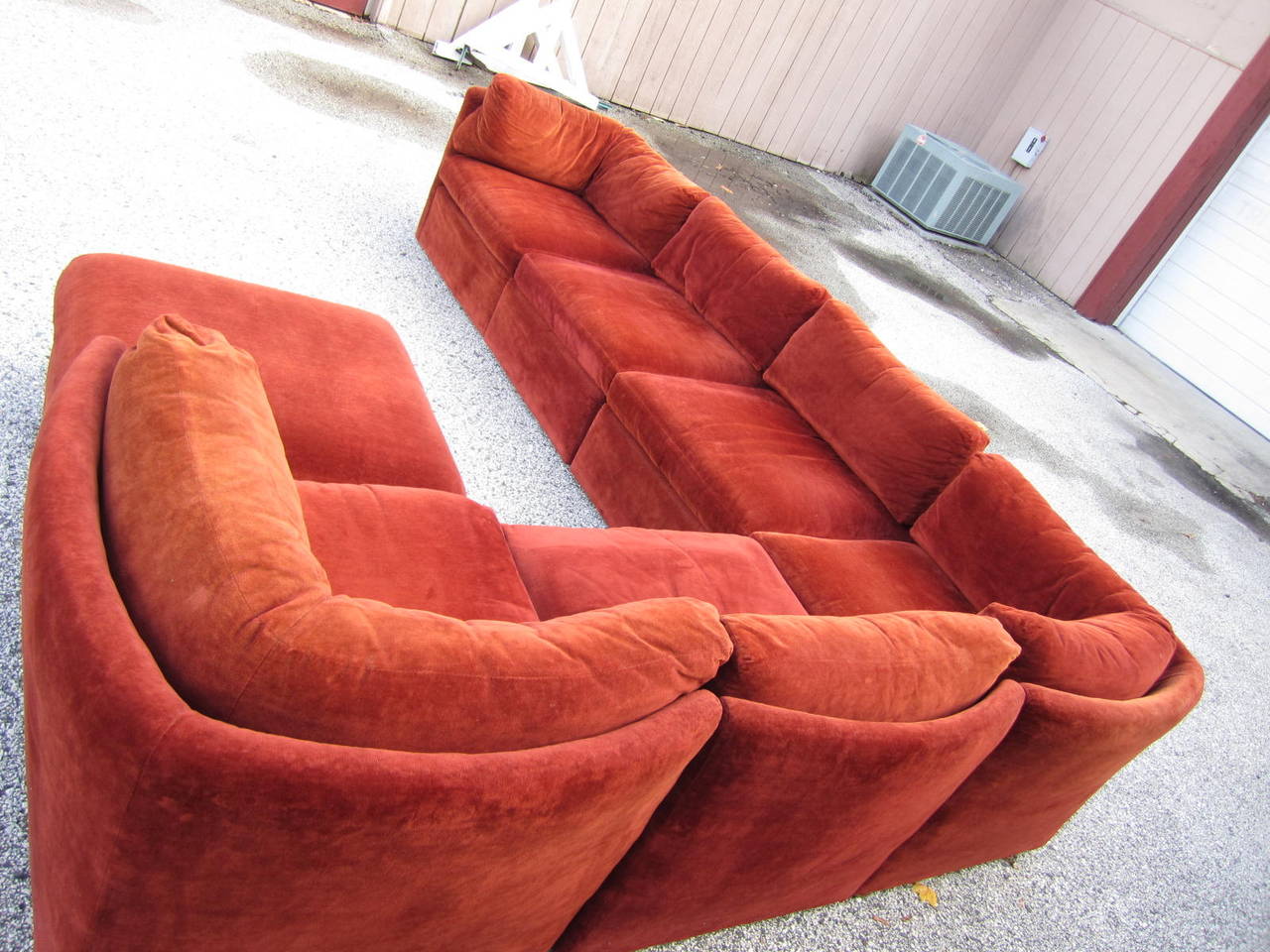 Signed Milo Baughman designed seven curved piece sectional sofa. Each piece has a curved outer frame giving the entire sofa a scalloped edge-very unusual and rare. This sofa will need to be reupholstered but that's what you designers are looking for