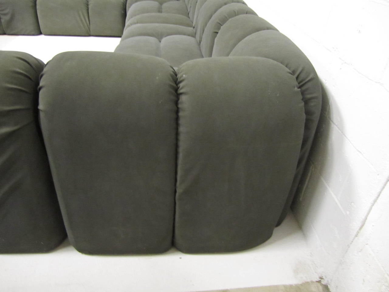 Amazing super rare seven-piece sectional sofa by Paul Evans. Unusual large random tubular tufted sections give this huge sofa a fabulous modern overall look. Upholstered in the first version of ultrasuede in a dark grey-still very comfortable. This