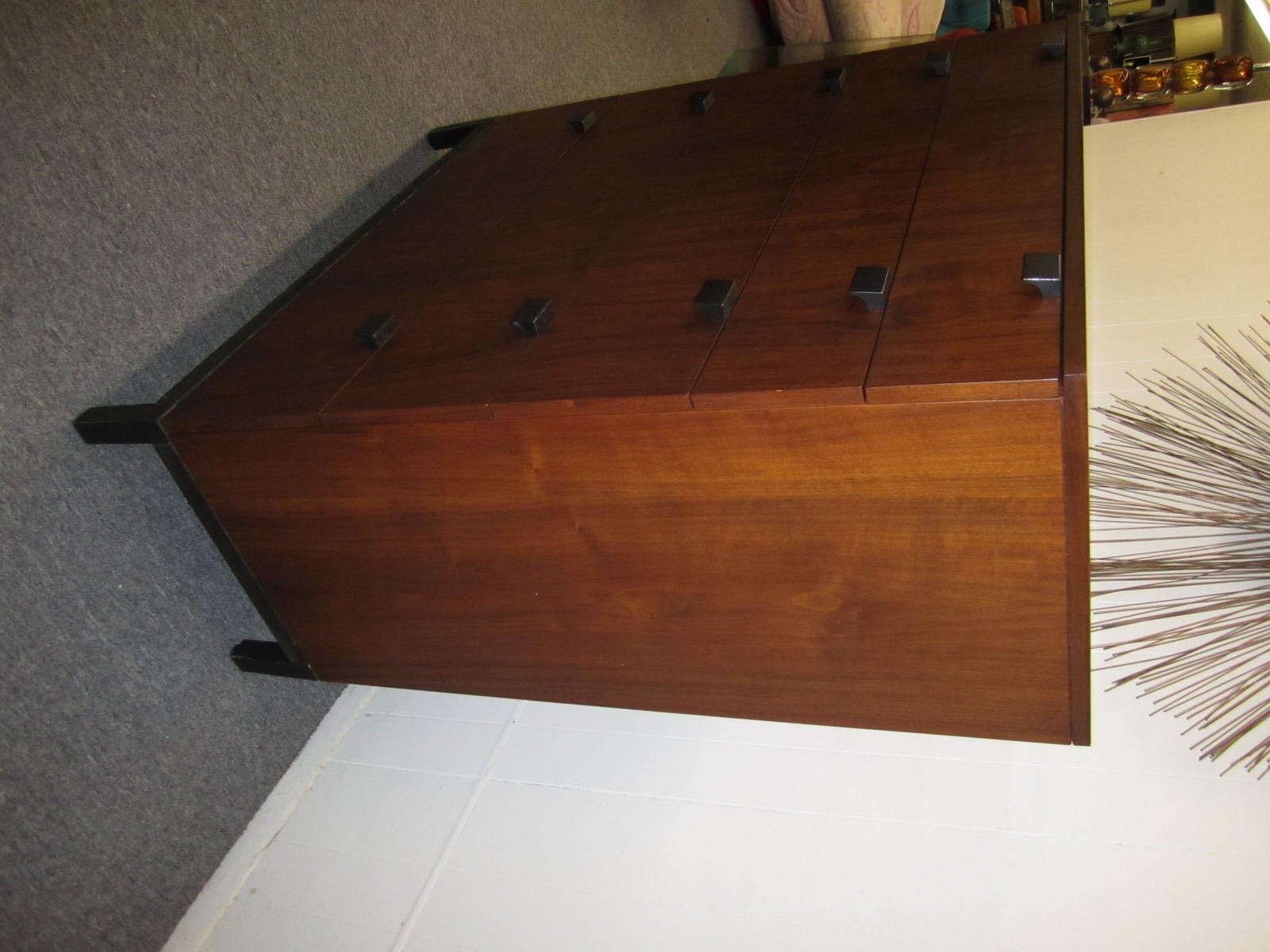 Handsome Milo Baughman for Directional tall walnut dresser.  Simplistic in design with ebonized solid wood pulls and legs.  Please note that we also have the matching credenza listed in another of our 1stdibs listings