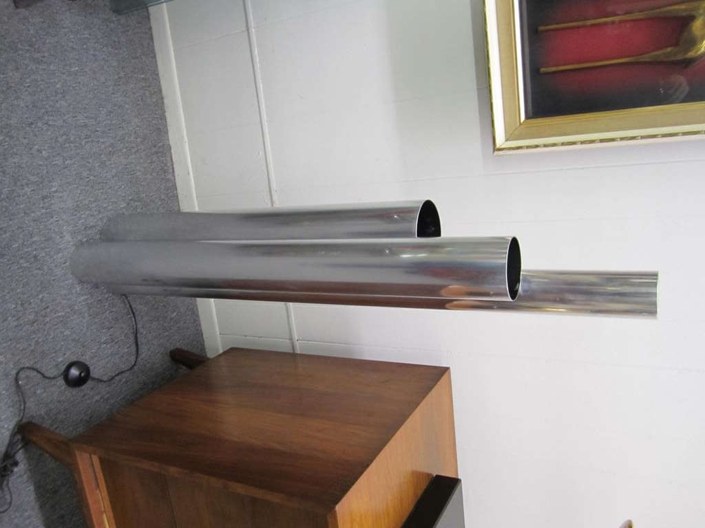 Tubular chromed aluminum skyscraper lamp. Designed as a floor lamp, but shows well as a table lamp. Simplistic yet sophisticated.