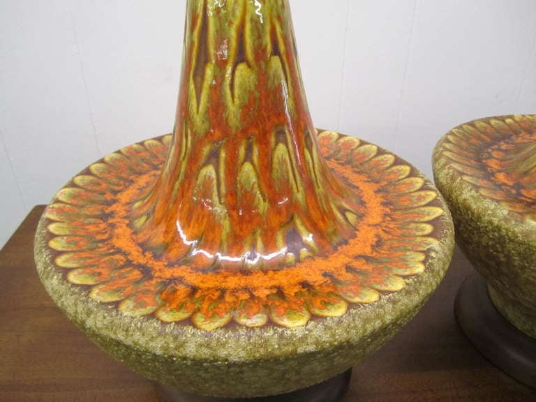 Gorgeous pair of extra large Danish modern drip glaze lamps.  Vibrant orange drip glaze on the top and textured sandy glaze on the underside. These lamps measure 35