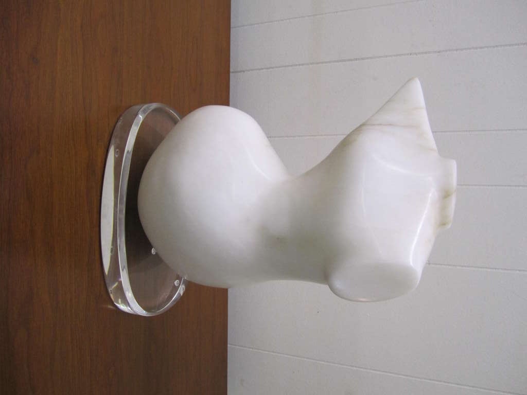 Magnificent carrera marble sculpture of a stylized female torso on a thick piece of lucite base.  We were lucky enough to purchase this amazing piece from the 95 year old artist herself.  She was an amazing artist and said she rubbed elbows with all