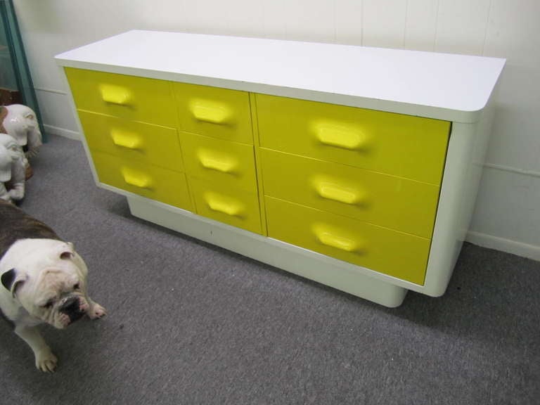 Space age injection molded plastic drawer fronts. White laminate top over lacquered case.  In very good condition. Manufactured by Broyhill, well crafted design.  You will love this colorful piece in the bedroom or any living space.
