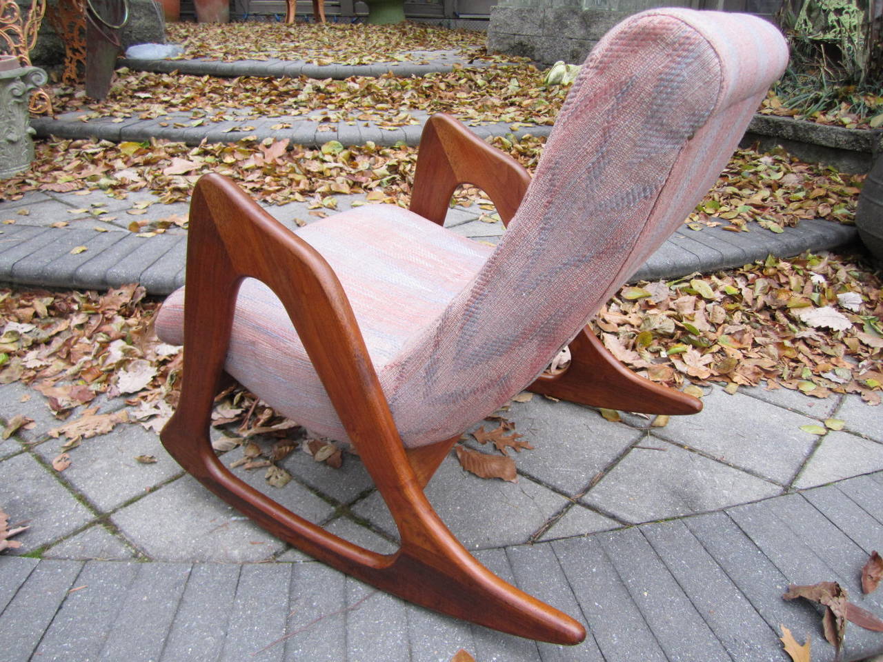 Gorgeous Adrian Pearsall sculptural walnut rocker. The solid walnut frame is tight and sturdy-looks more like a work of art than a rocker.This piece is sure to please and will be an added treasure to your collection