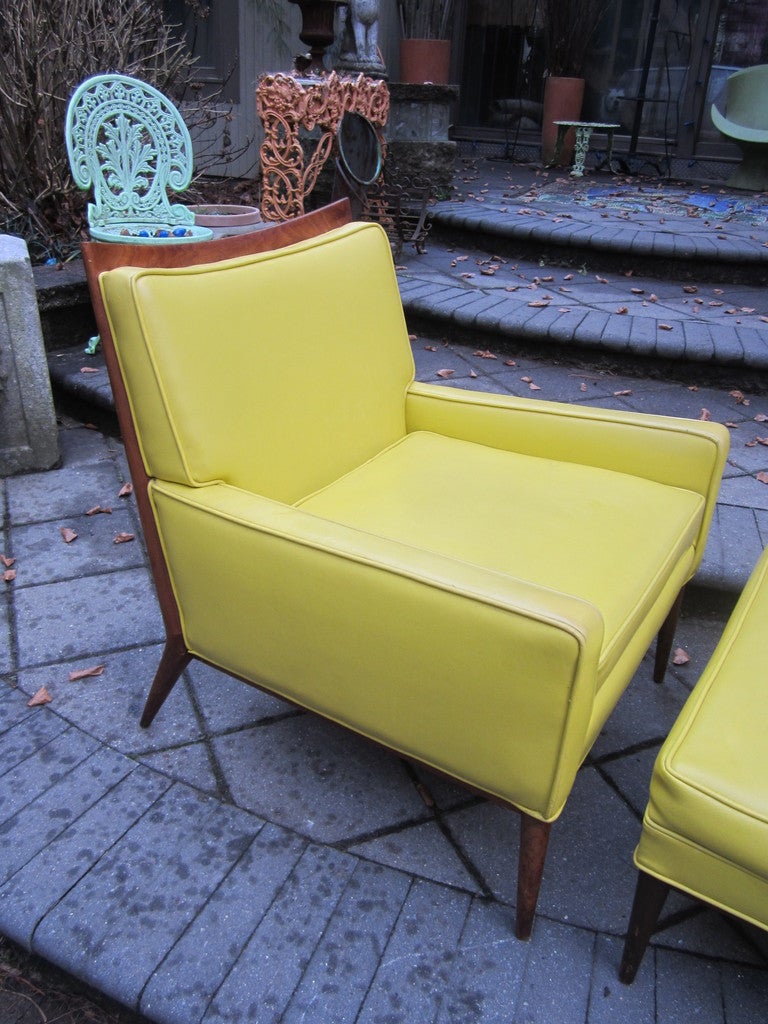 GORGEOUS PAUL MCCOBB YELLOW FAUX LEATHER LOUNGE CHAIR AND OTTOMAN.  THIS PIECE IS COVERED IN  ORIGINAL VINTAGE FAUX YELLOW LEATHER AND LOOKS GREAT WITH ONLY MINOR WEAR.  IT IS CLEAN  AND PERFECTLY USABLE IN IT'S VINTAGE CONDITION.  THE OTTOMAN DOES
