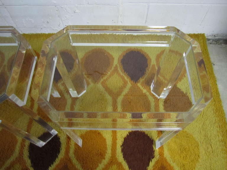 Stunning pair of Charles Hollis Jones Lucite and glass end tables. Gorgeous thick Lucite with faceted legs. These tables are in great vintage condition with no chips to the Lucite and no crazing or yellowing. They are meticulously well-made with