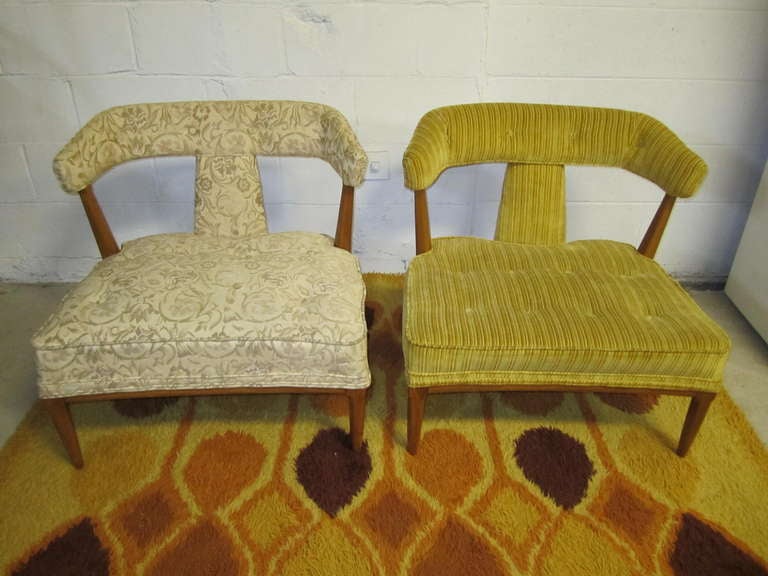 Fabulous Pair of Robsjohn Gibbings style lounge chairs.  These chairs are part of the Sophisticates series made by Tomlinson.  They have a super wide low seat and gorgeous saber wooden legs.  These are what i call designer delights-great bones but