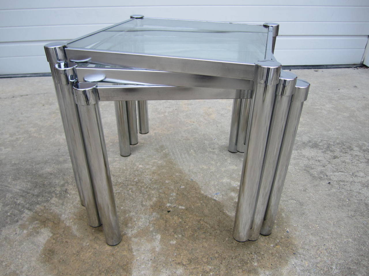 Fun set of Milo Baughman style square chrome and glass stacking side tables.  A must have set of vintage nesting tables if you do a lot of entertaining.