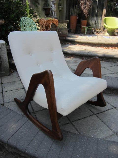 Outstanding reupholstered Adrian Pearsall rocking chair. This piece is in very nice restored condition. The sculptural walnut legs look amazing like carved pieces of art. The upholstery is newly done in vintage hopsack fabric and looks fresh and