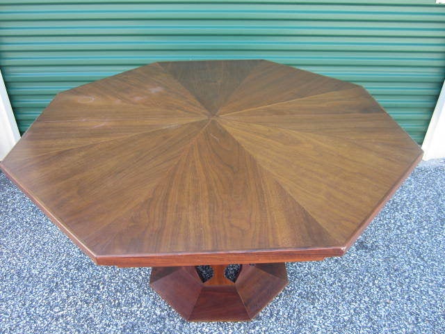 GORGEOUS MID-CENTURY MODERN CATHEDRAL STYLE PROBBER INSPIRED PEDESTAL DINING TABLE WITH THREE LEAVES.  THE TOP IS AMAZING WITH CIRCLE INLAYS AND A DYNAMITE OCTAGON SHAPE.  THE BASE HAS A HARVEY PROBBER INSPIRED PEDESTAL AGAIN WITH CIRCLE INLAYS. I