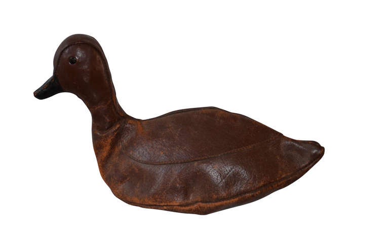 Charming vintage Abercrombie & Fitch leather duck decoy with zipper access to store one or two T-shirts.