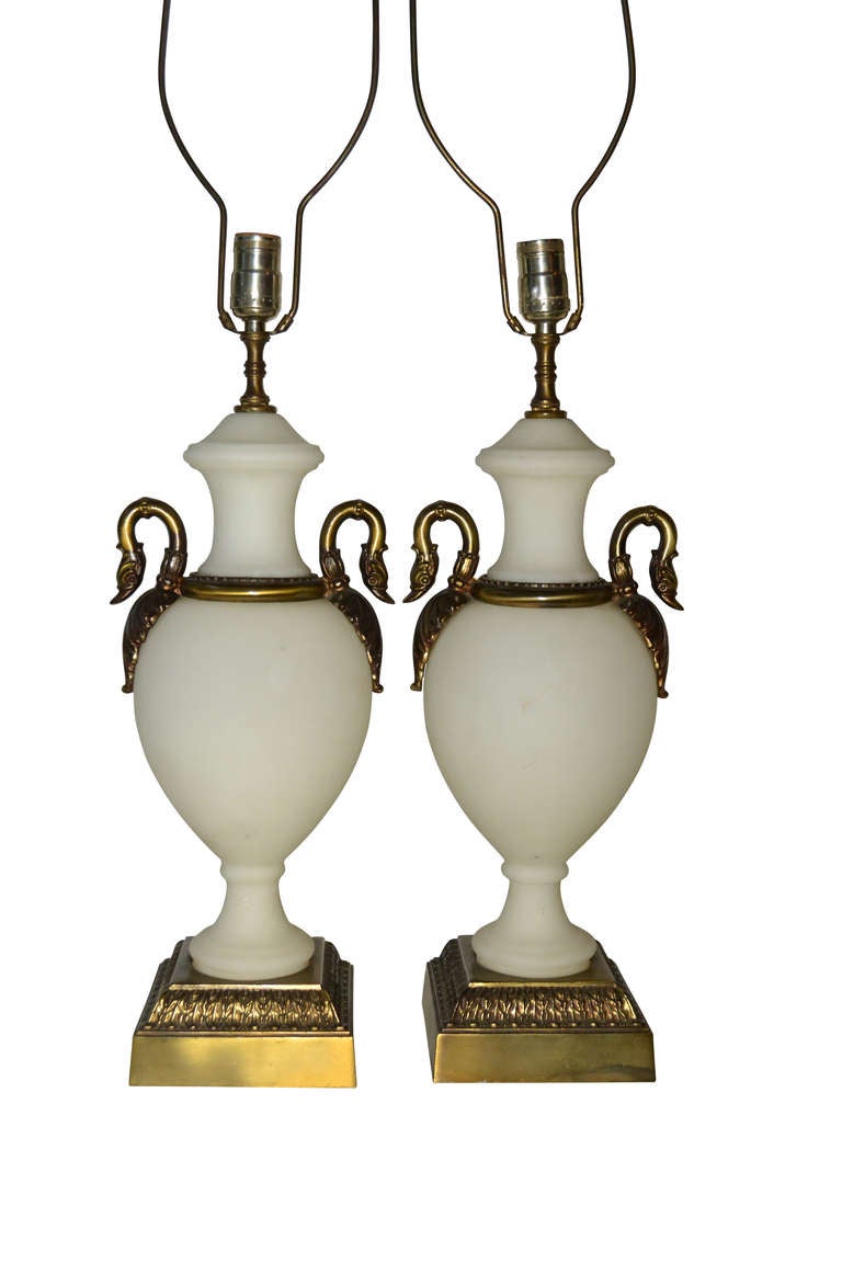 French pair of matte white swan neck opaline lamps on a square bronze base with original patina.