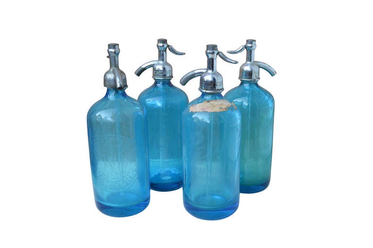 4 Azure-blue American seltzer bottles