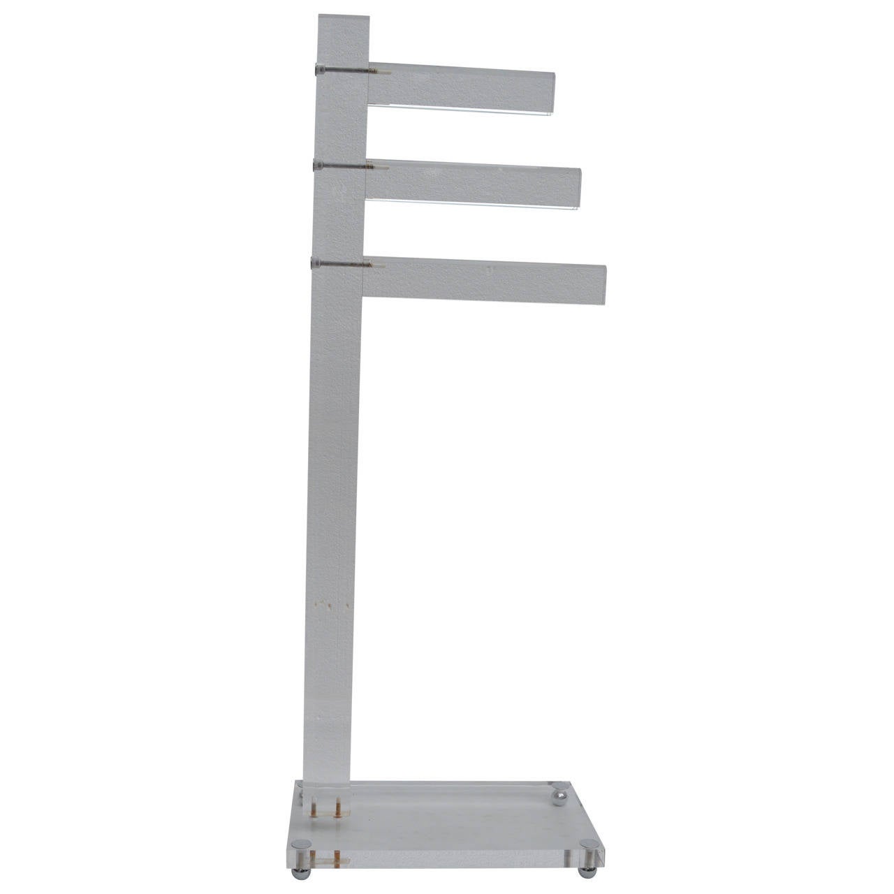 A three-bar, freestanding Mid-Century Lucite towel rack. Great design with versatility. Would also be serve well as a display piece for decorative textiles.