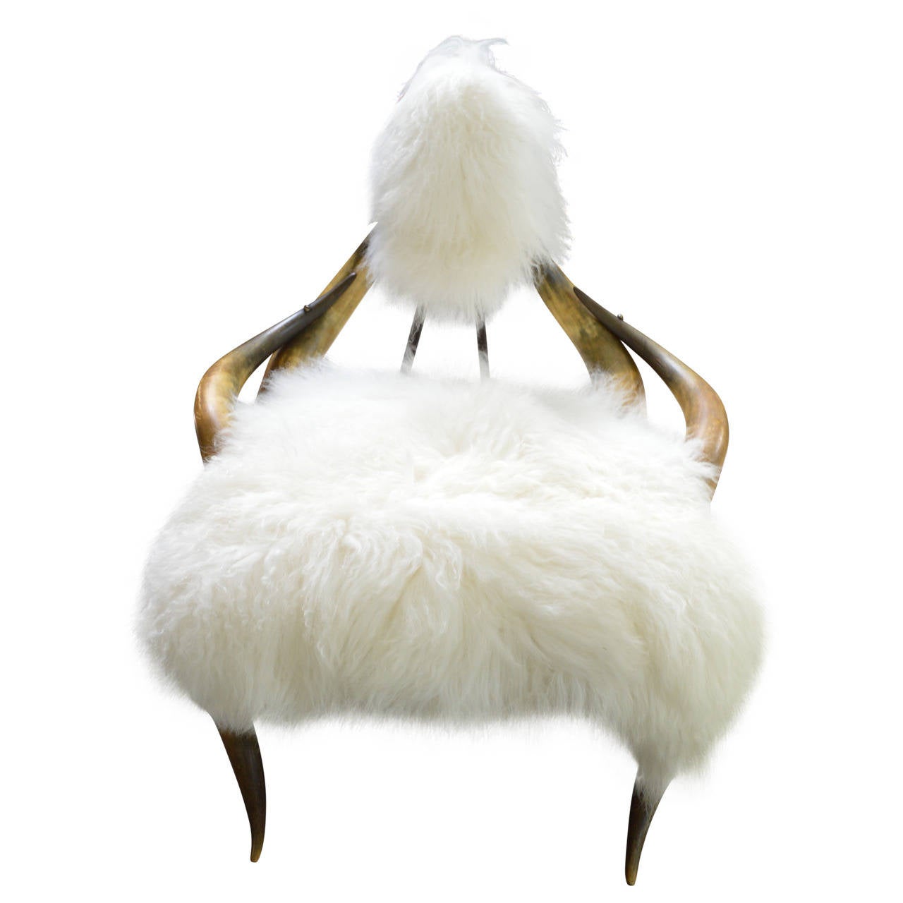 This is a true statement piece...wow!
Constructed of Texas Longhorn cattle horns.
Completely re-tied and reupholstered in gorgeous white Mongolian sheep pelts.