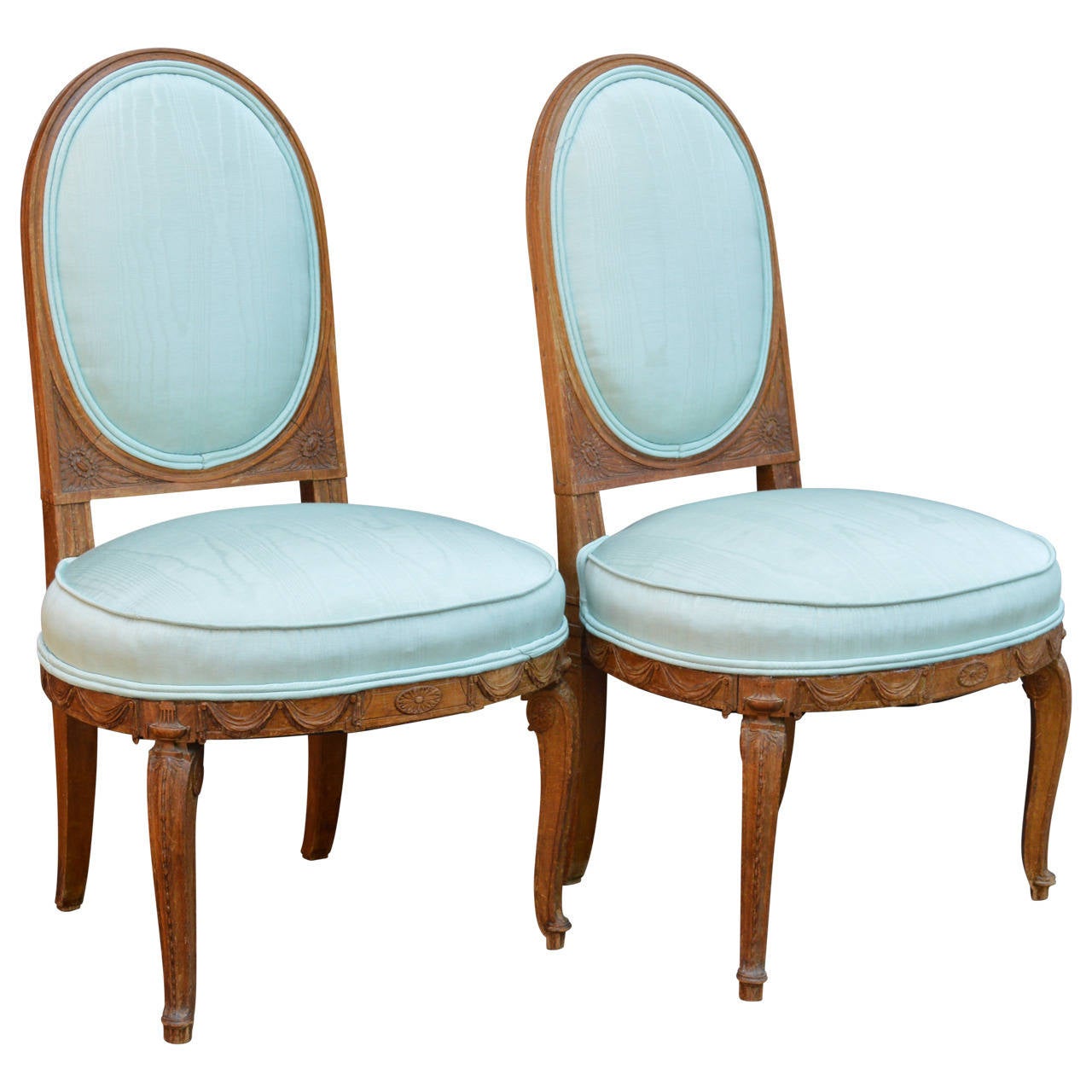 Exquisite pair of Louis XVI slipper chairs, newly upholstered in pale turquoise silk moire.