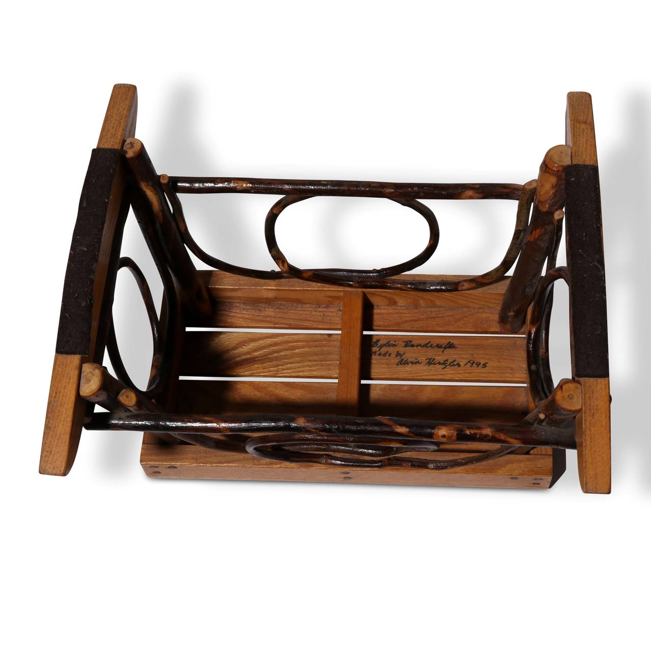 Handcrafted, signed and dated by the maker in 1995, this rocker and footstool are classic examples of excellent Amish craftsmanship. Original lacquered pine and twig construction and finish. Rugged and sturdy, perfect for afternoons on the porch or