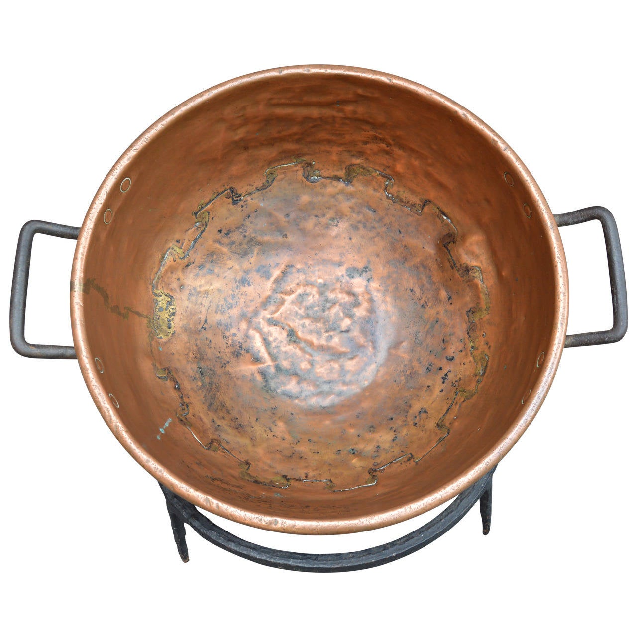 Large beautifully hammered copper cauldron with hand-forged iron base. Has a very nice patina due to history.