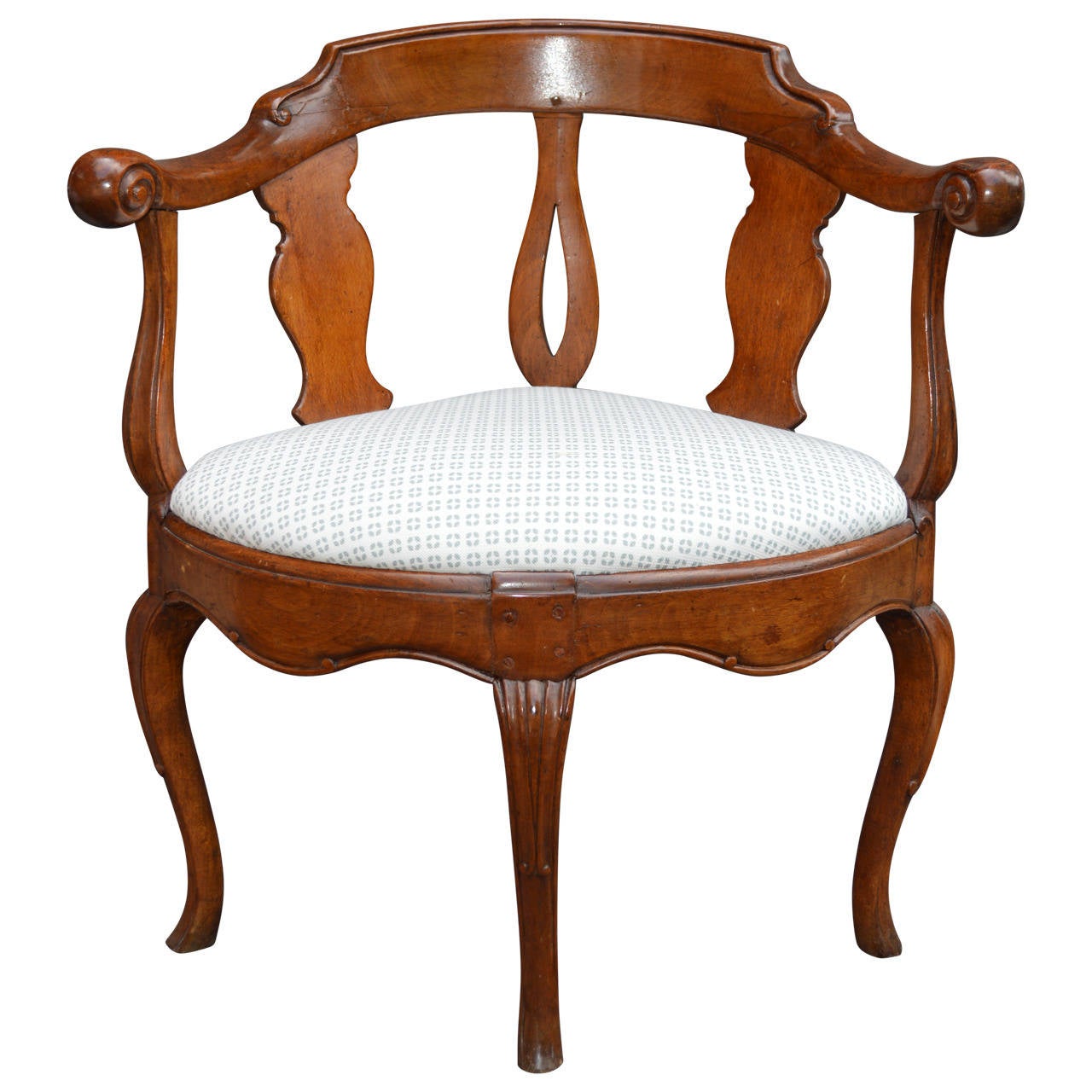 Beautiful Danish fruitwood corner armchair upholstered with versatile white fabric with small teal diamond pattern.