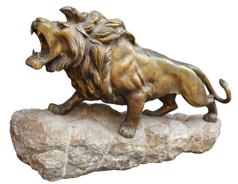 Large bronze lion on a granite base, signed Bousquet (Robert Bousquet)