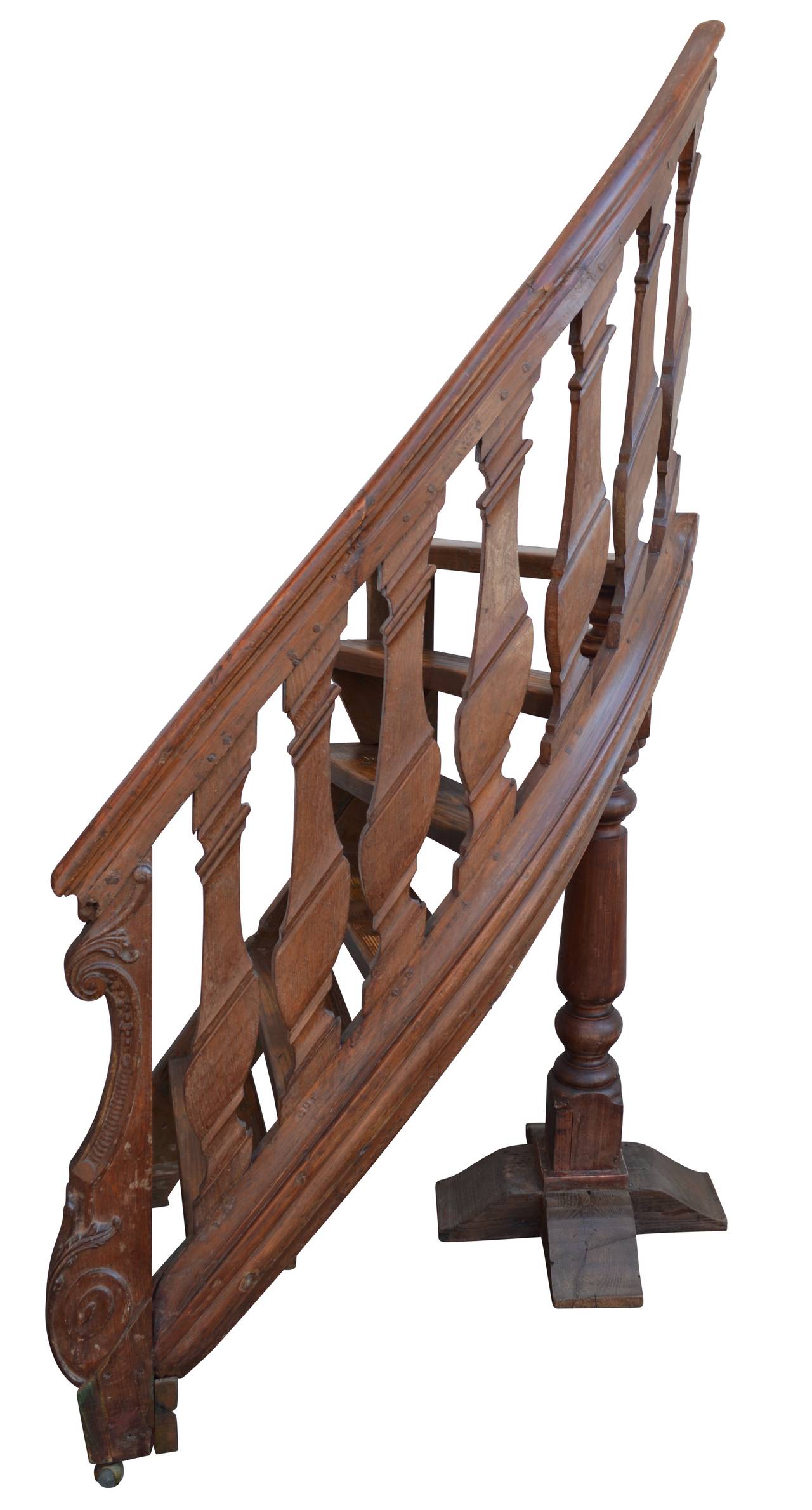 Two-piece library ladder on two "claw on ball" wheels. Railing from an 18th century Dutch Rococo library staircase and steps are of later date.